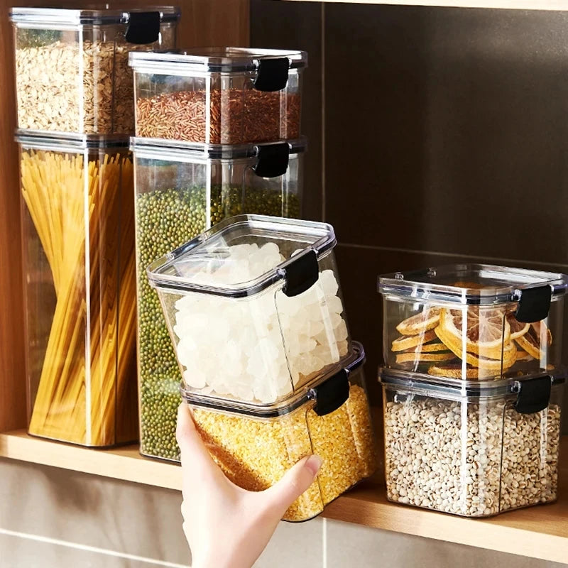 Clear storage containers with food on a kitchen shelf